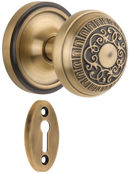 Classic Rosette Mortise Lock Set With Egg And Dart Door Knobs in Antique Brass finish.